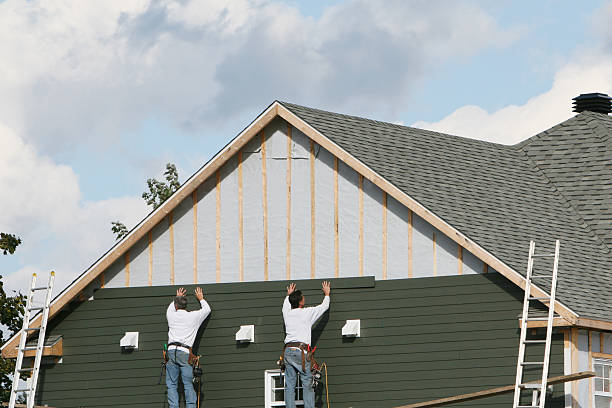 Professional Siding Installation technician working in Elm City, NC